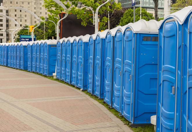 hygienic portable restrooms lined up at a beach party, ensuring guests have access to the necessary facilities while enjoying the sun and sand in Melville